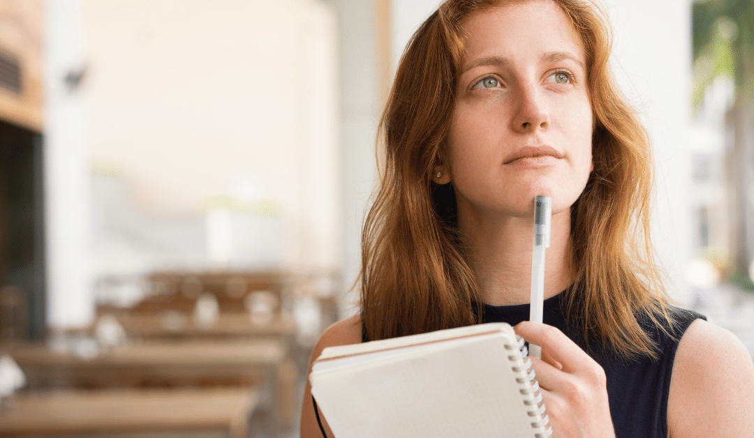 Woman thinking about when she should outsource her content writing